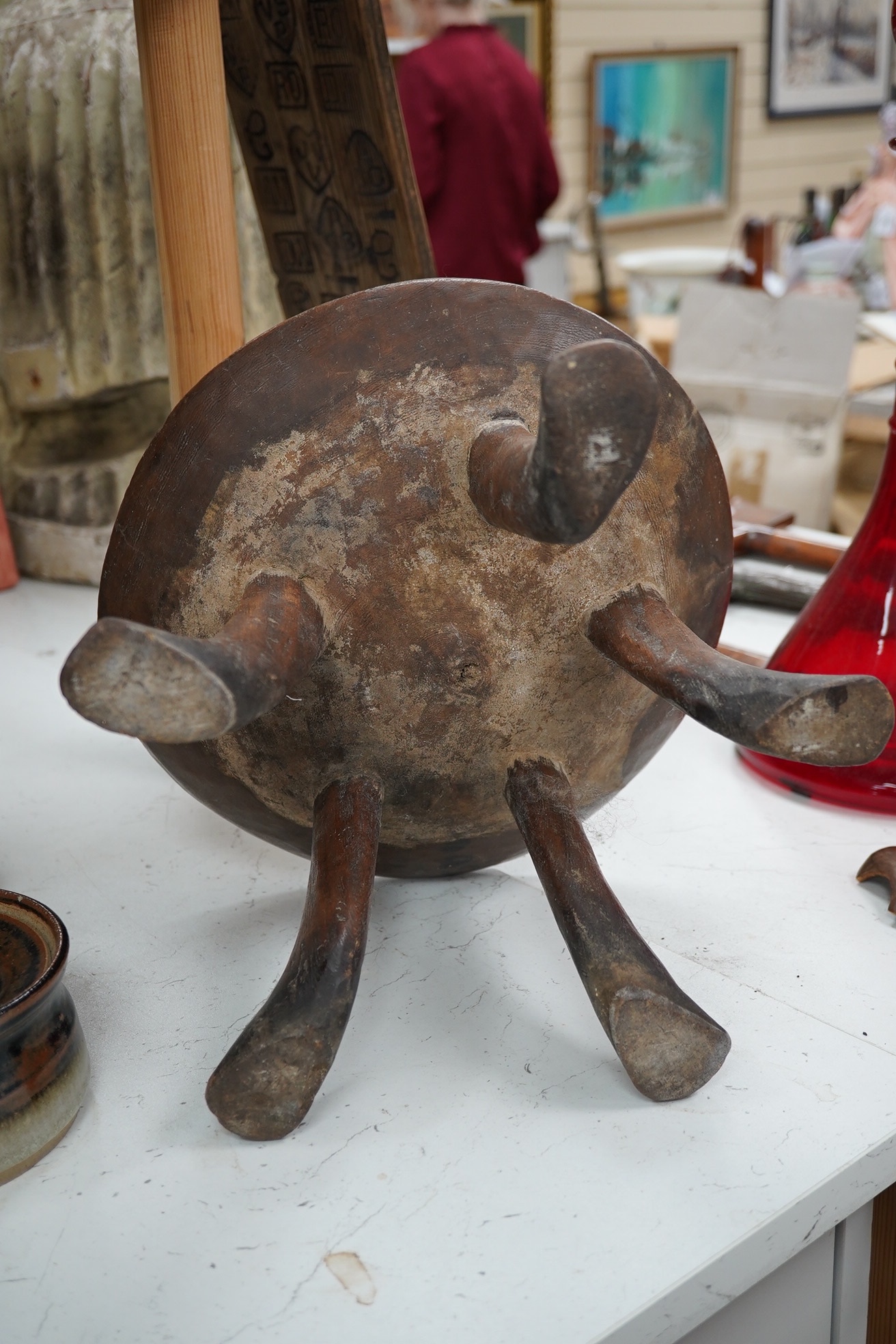 An African five-legged wooden bowl, 21cm high. Condition - fair